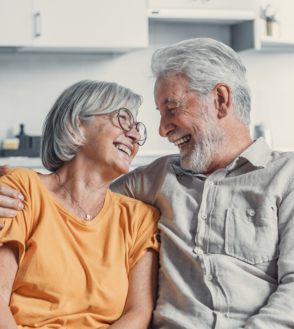 senior couple looking at each other smiling