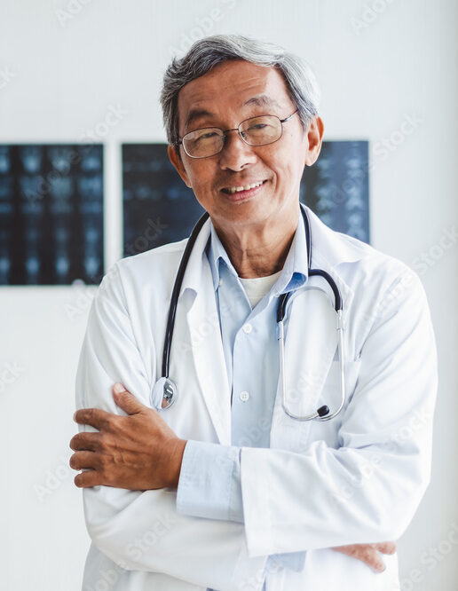 doctor holding patient file smiling at desk