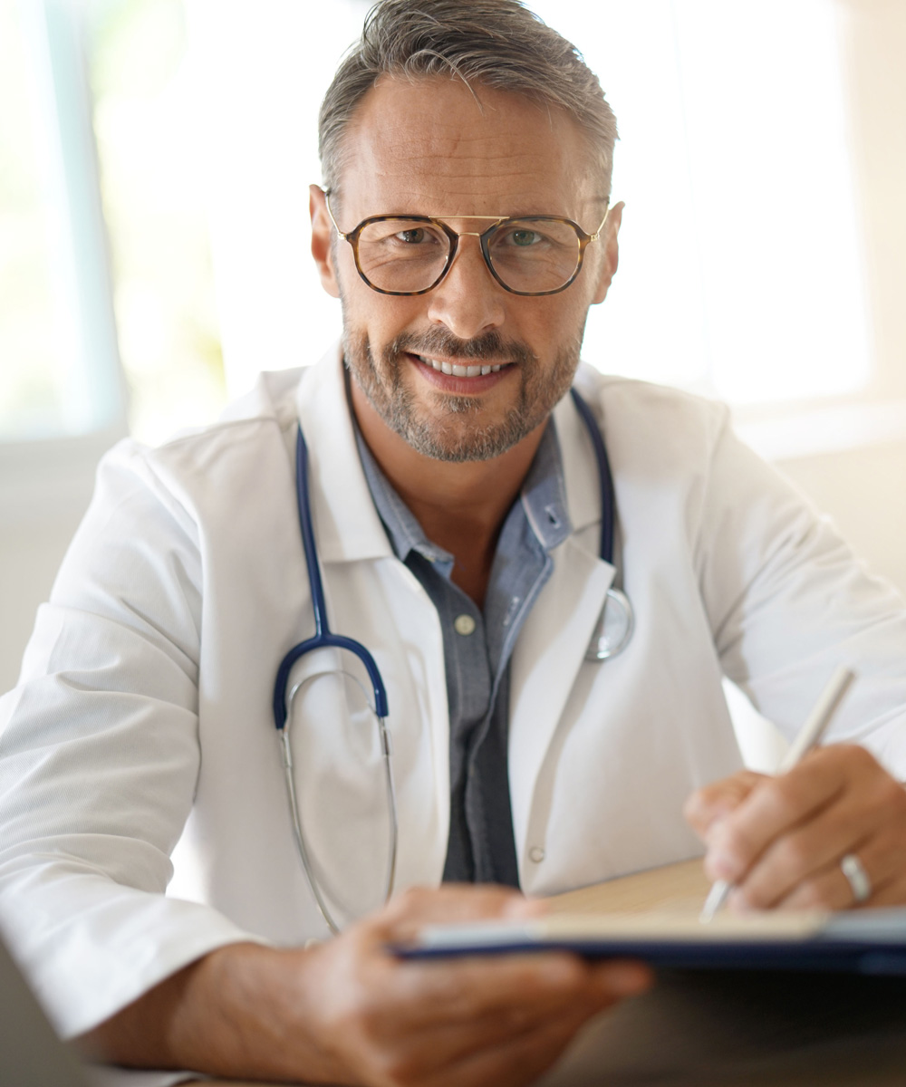 doctor writing on clip board