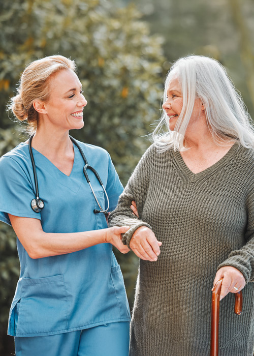 medical professional walking with patient